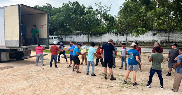 Unloading Chick tracts from truck in Mexico.