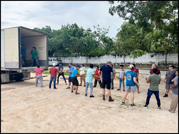 Oaxaca, Mexico - People from many ministries helped unload the last truck.