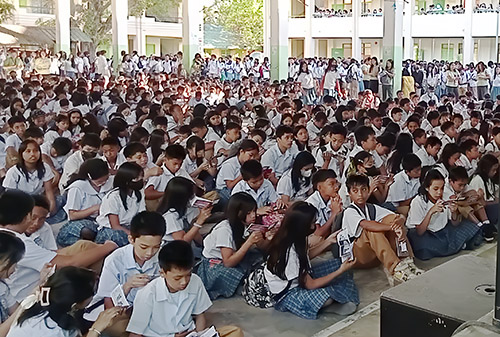 High schoolers in the Philippines reading Chick tracts