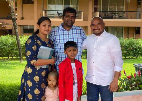 Jyothi and her husband with their two kids