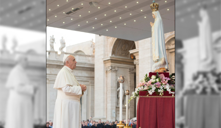 Pope Francis strikes a worship pose to an idol of the Virgin Mary goddess at Fatima.