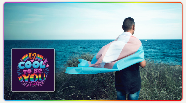 A young person holding a transgender pride flag.