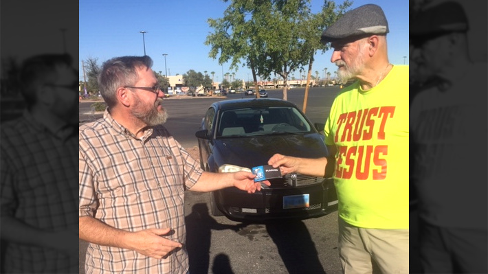 Evangelist Tim Berends hands out tract entitled, 'Plagues'.