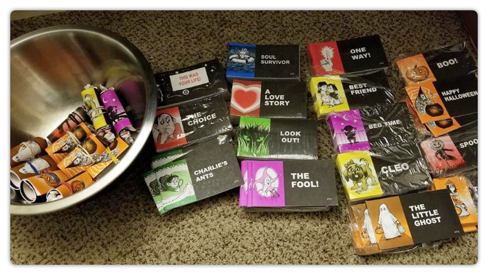 A tract with candy rolled up with a rubber band.