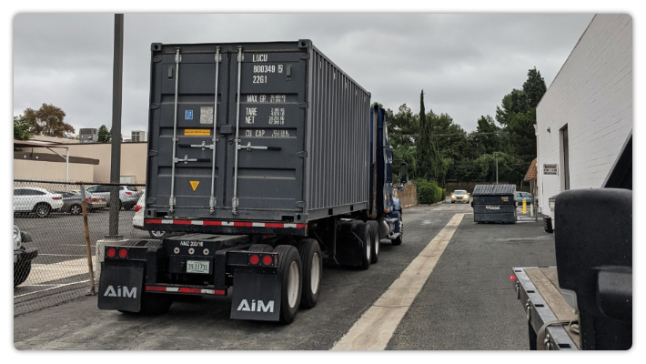 Truck leaves Chick Publications to take container to port.